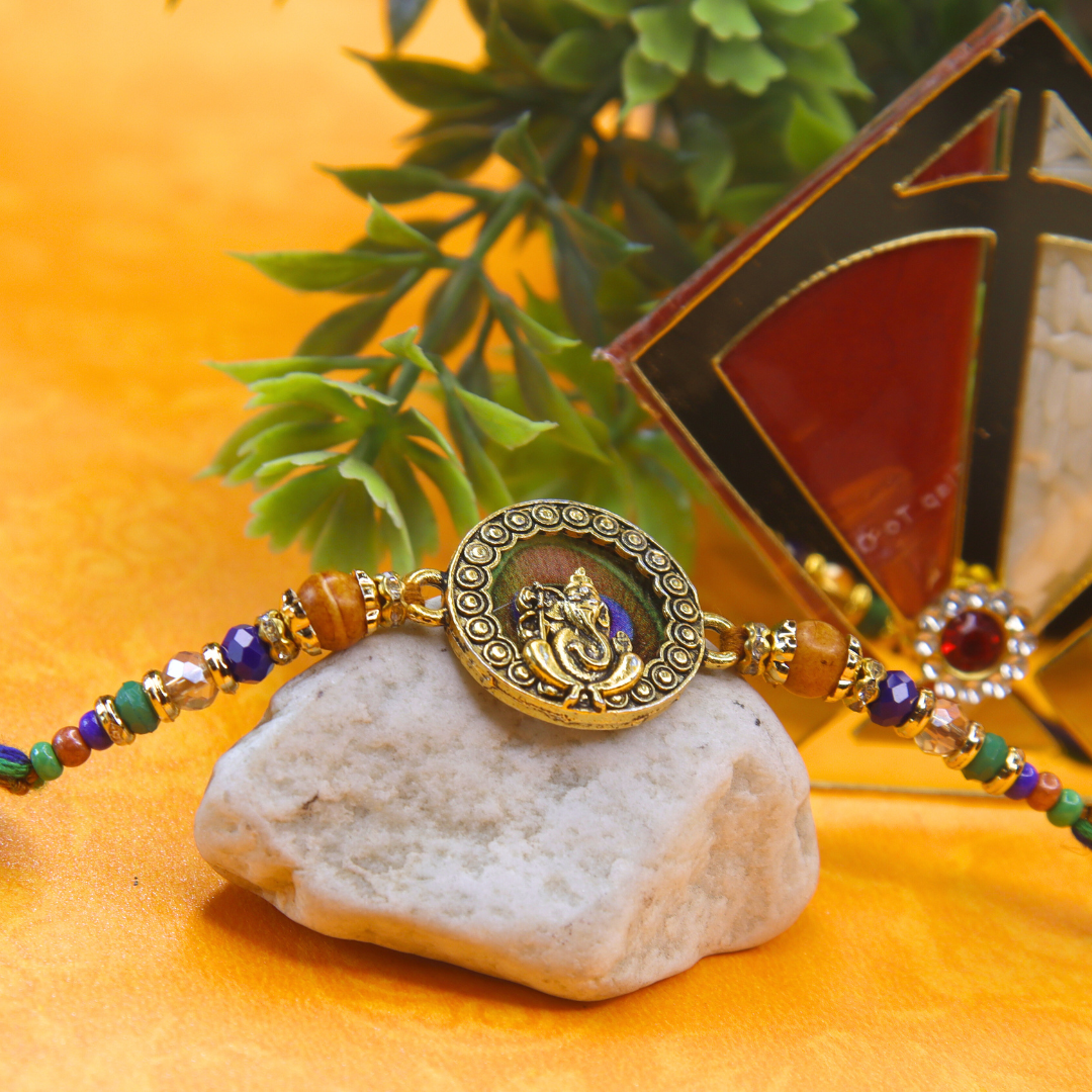 Vera Ganesha Rakhi for Brother – Antique Round Rakhi with Lord Ganesh Motif, Beaded Thread & Traditional Design – Handmade for Raksha Bandhan