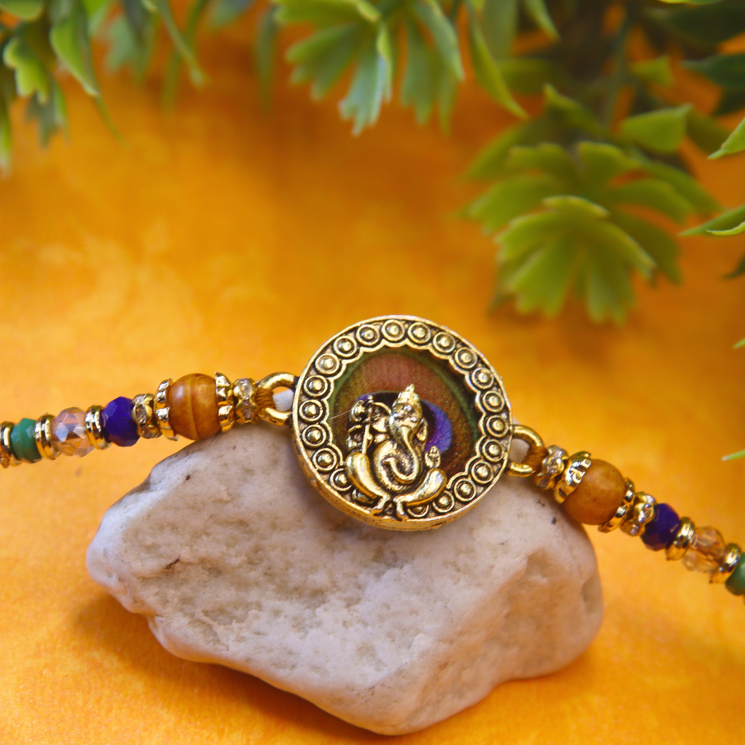 Vera Ganesha Rakhi for Brother – Antique Round Rakhi with Lord Ganesh Motif, Beaded Thread & Traditional Design – Handmade for Raksha Bandhan