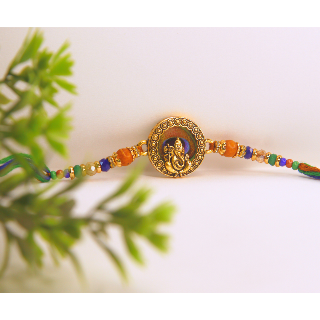 Vera Ganesha Rakhi for Brother – Antique Round Rakhi with Lord Ganesh Motif, Beaded Thread & Traditional Design – Handmade for Raksha Bandhan