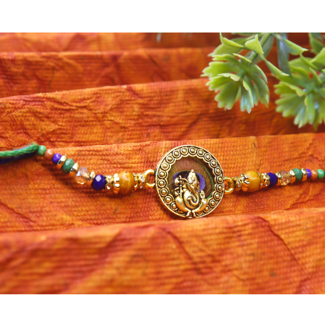 Vera Ganesha Rakhi for Brother – Antique Round Rakhi with Lord Ganesh Motif, Beaded Thread & Traditional Design – Handmade for Raksha Bandhan