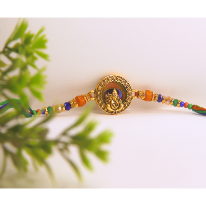 Vera Ganesha Rakhi for Brother – Antique Round Rakhi with Lord Ganesh Motif, Beaded Thread & Traditional Design – Handmade for Raksha Bandhan